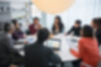 Business team meeting around table, reviewing data