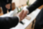 Businessmen shaking hands, sealing a deal