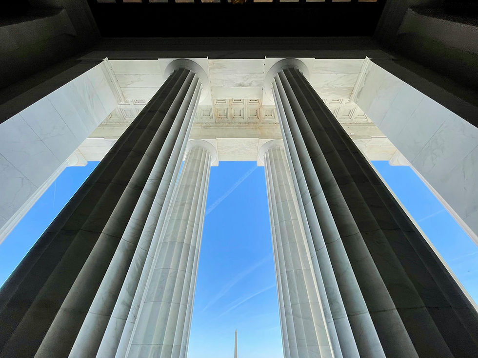 Monumental columns against a vivid blue sky