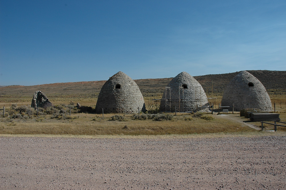 Three beehive-shaped charcoal kilns on the Wyoming plains. Piedmont charcoal kilns in Wyoming.