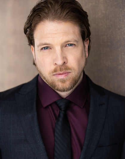 Michael Lieberman Actor headshot wearing a suit and tie