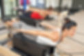 Two girls are exercising pilates using p