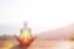 Beautiful woman sits in a pose of a half lotus on high place amazing view of the island ou