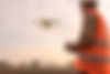 male-engineer-controlling-drone-spraying-fertilizer-pesticide-farmland.jpg