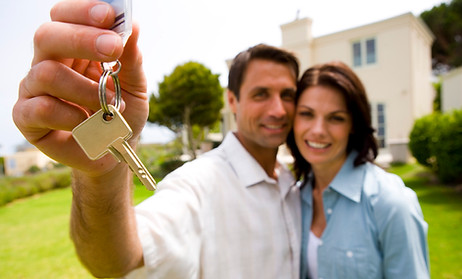 Homeowners with keys to new home