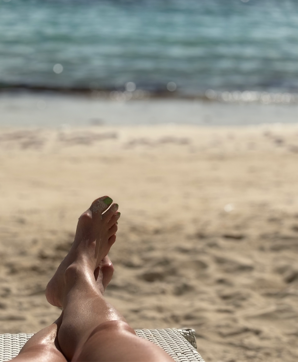 an excerpt from the poem Be..There by Barefoottheology.ca showing barefeet with the backdrop of a white sandy beach and ocean