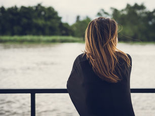 A woman looking out to a river