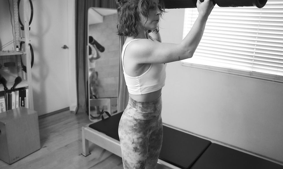 A person performing an exercise designed to improve functional movement and strength.