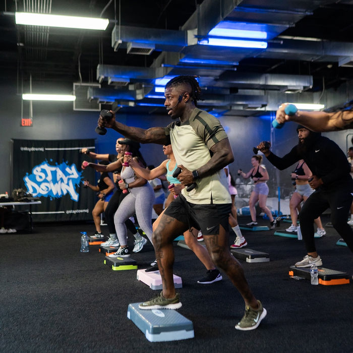 Group fitness class with step platforms
