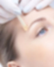 Remedy Spa Hawaii Therapist perfoming Wax service on model