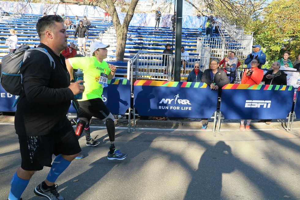 Sam and his cousin Tony running a 5K in Nov 2016, 8 months post amputation and 4 months after Sam's initial prosthetic fitting