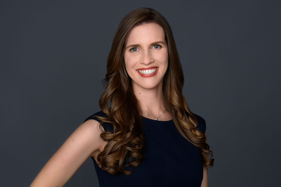 Professional woman smiling, providing investing expertise.
