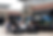 Car enthusiasts check out a Chevrolet Camaro at Whisk Coffee and Wine Bar on June 28