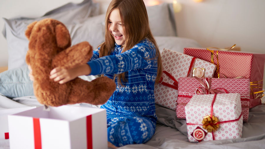 Family wrapping toys and gifts to send to Nicaragua for Christmas and birthday celebrations with Tuanigo.