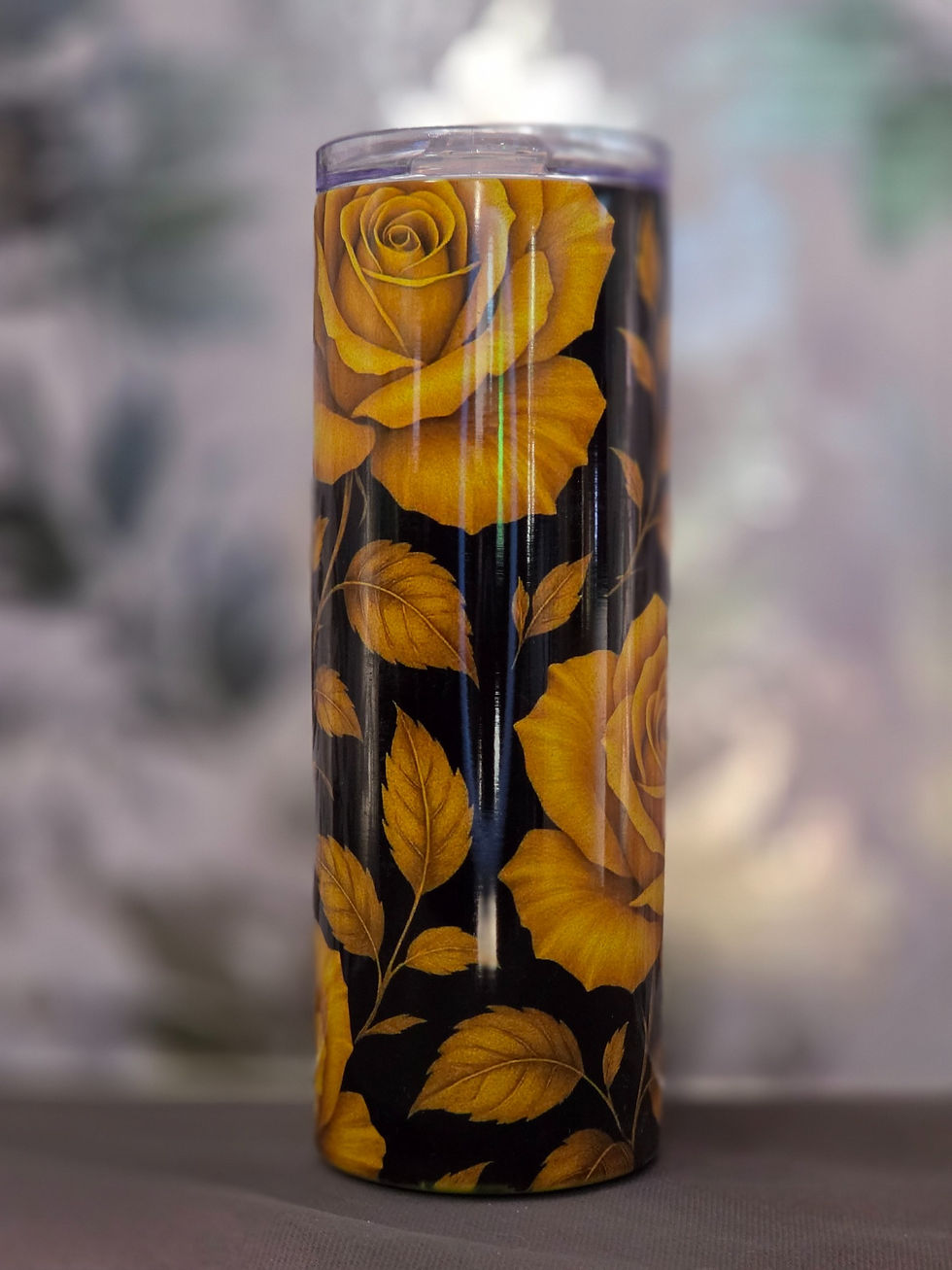 20oz holographic skinny tumbler with large golden yellow roses and leaves on a black background