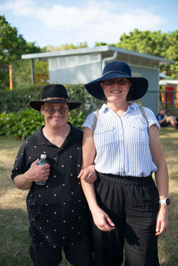 Two people smiling together for a photo, enjoying First2Care's annual Picnic in the Park