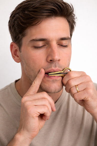 Man striking jaw harp