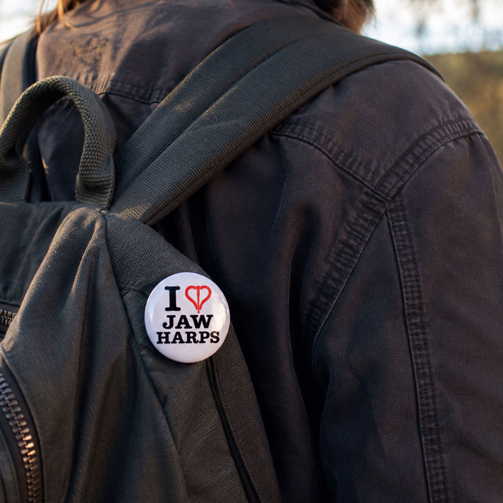 Button pin on a backpack that says "I love Jaw Harps"
