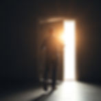 Man walking through a door