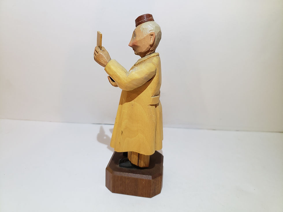 Thumbnail: Wooden Pharmacist Carving with Yellow Coat