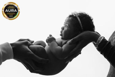 Aura Photography Gold Award - Backlit Baby in Parents' hands