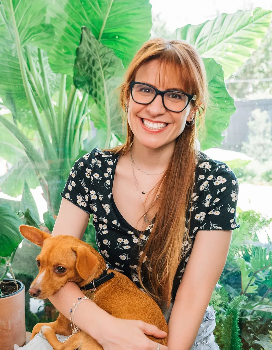 Ali Hazelwood holding their dog