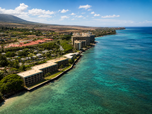 Top Oceanfront Condo Communities in West Maui for Buyers and Investors showing an aerial view of West Maui coastline featuring luxury oceanfront homes, turquoise waters, and scenic beachfront communities in Lahaina.