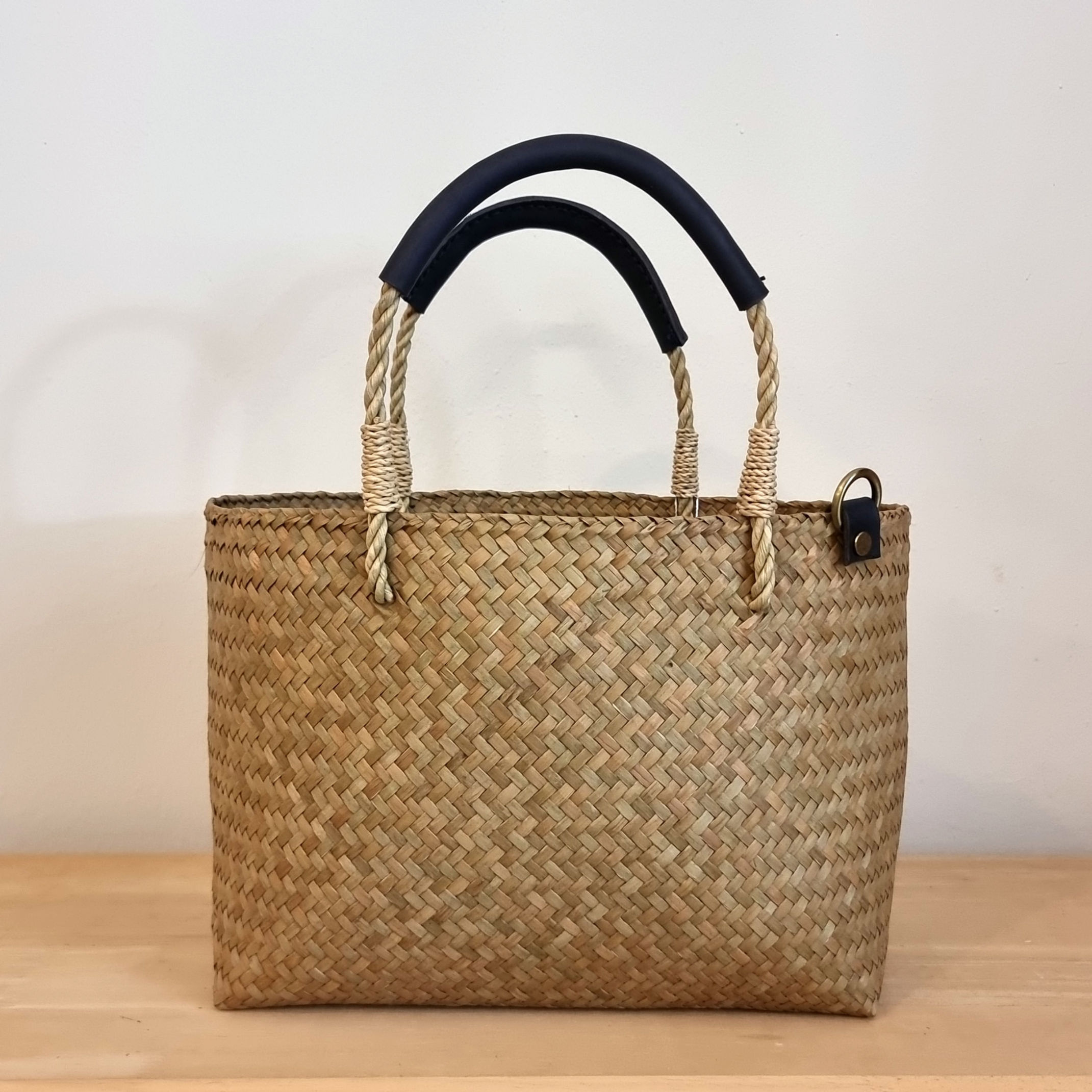 Wicker bag with leather handles.