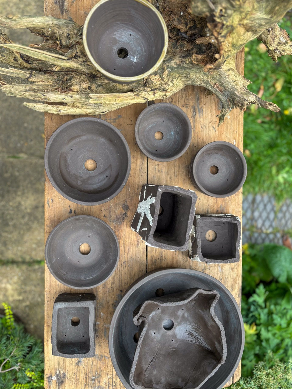 Japanese style handmade black clay pottery pieces showcased on a table