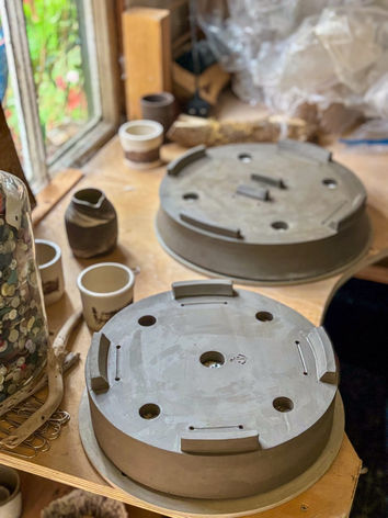 Clay pots drying in a studio