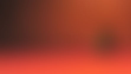 A headless man sitting in an empty room on a red rug with wooden walls.