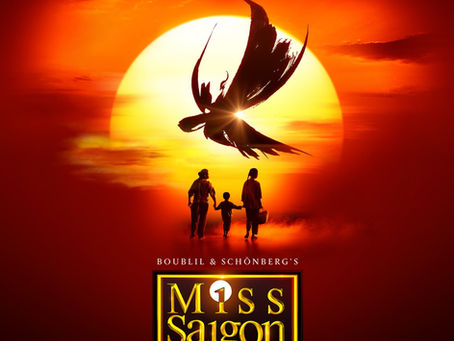 Silhouettes of three people walk towards a large sun. A helicopter silhouette is above. Text: Miss Saigon, The Legend Reborn. Warm colors.