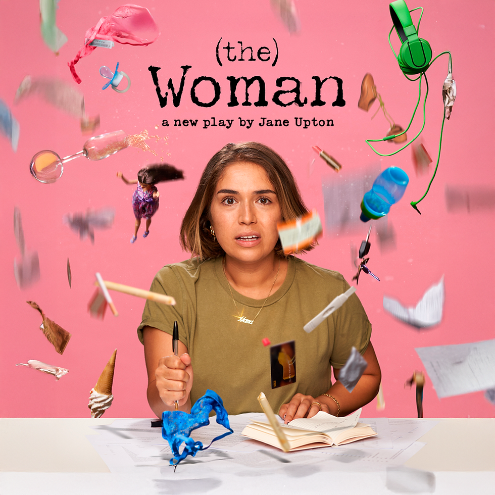 A woman in a green tshirt writing in a diary whilst things fall down around her