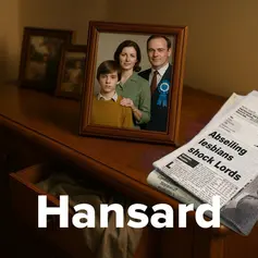 Framed family photo on wooden dresser with newspaper headline "Abseiling lesbians shock Lords." Text "Hansard" in bold at bottom.