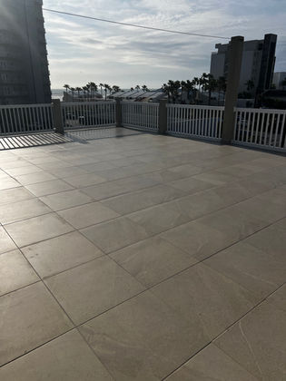 Waterproofed tile rooftop patio with large format tiles and ocean view