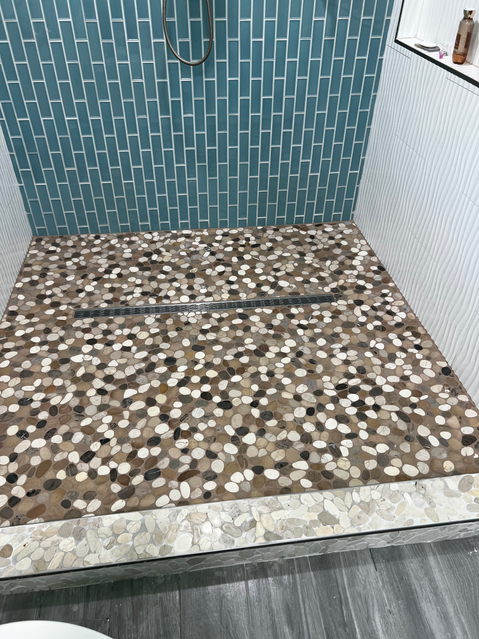 Custom pebble stone shower floor installation — Cameron County TX