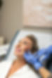 Injector treating woman’s face—regenerative aesthetics: spend $500, get $50 PRM gift card.
