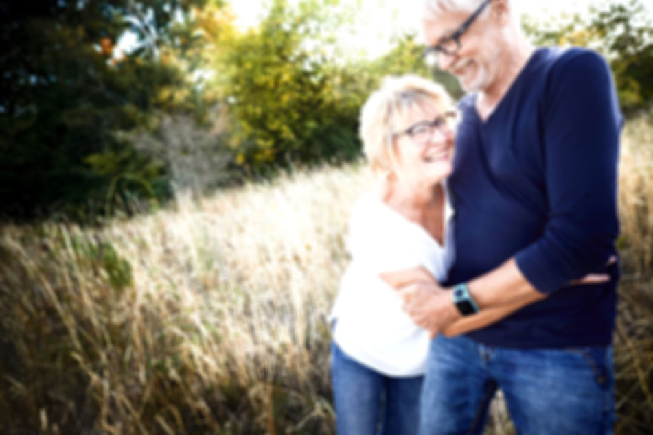 background image of happy couple who have received regenerative services in chico california