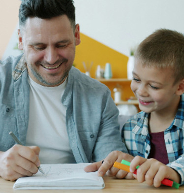 Parent and child practicing numbers together at home