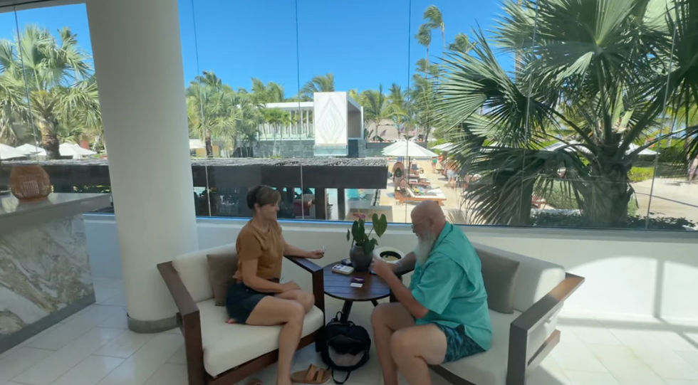 Randy and Lisa relaxing and playing cards at Secrets Royal Beach Punta Cana