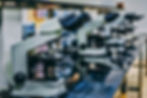 Row of Microscopes on a Table
