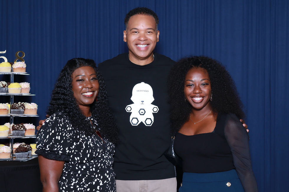 Three guests posing together against a navy blue backdrop during an A&A Booths photo booth experience.