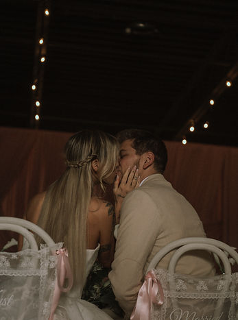 Couple kissing at A&A Booths luxury wedding photo booth experience in Raleigh NC