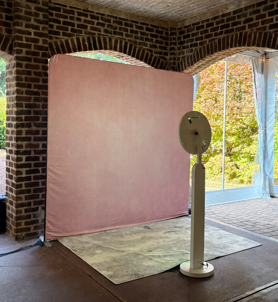 A&A Booths digital photo booth with pink backdrop at an event in Raleigh, NC
