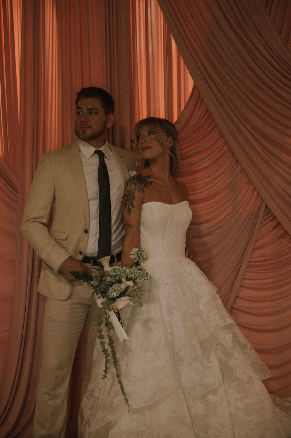 Couple celebrating at wedding reception with A&A Booths luxury photo booth rental in Raleigh NC