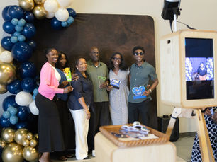 Guests using a branded corporate photo booth at a Raleigh, NC even