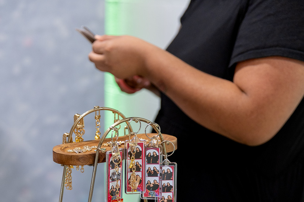 Personalized event keychains with guest photo strips and decorative charms