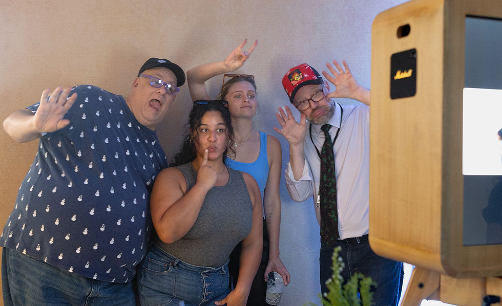 raleigh-photo-booth-guests-enjoying-prints