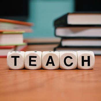 Dice letters spelling Teach