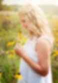 Teen girl in field of daisies